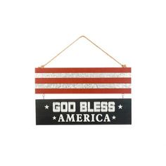 a sign that says god bless america hanging from a rope on a white wall with stars and stripes