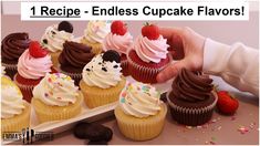 cupcakes with chocolate frosting and strawberries are on a white plate next to a hand