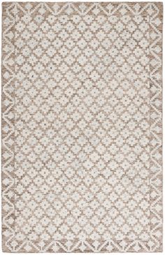 a beige and white rug with an intricate design