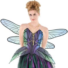 a woman in a purple and green fairy costume