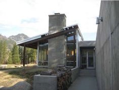 a stone building with a fire place next to it