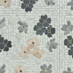 a tile wall with flowers on it and white bricks in the backgroung