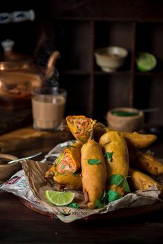 a pile of food sitting on top of a wooden table