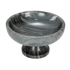 a black marble bowl sitting on top of a wooden stand with one end turned to the side