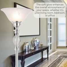 a lamp that is sitting on top of a table in front of a mirror and door