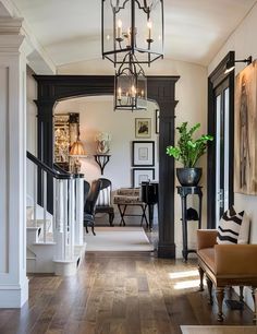 the hallway is clean and ready for guests to use it as an entrance way in this home