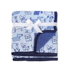 the blue and white blanket has an animal print on it, with a bow at the end