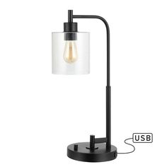 a black lamp with a clear glass shade on the base and an usb cable attached to it