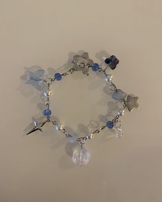 This cute blue fairycore bracelet is adorned with butterflies and stars. Dark blue beads with white pearls gives it it's starry night aesthetic. IMPORTANT: Make sure this bracelet is your size. It is 7 inches and the size can't be readjusted due to toggle clasp. To make sure it fits you take a measuring tape and put it around your wrist. From there you can decide if this bracelet size is right for you :) Blue Charm Bracelet, Blue Bracelet Ideas, Fairycore Bracelet, Starry Night Aesthetic, Blue Beads Bracelet, Dark Blue Bracelet, Blue Starry Night, Blue Bracelets, Girly Bracelets