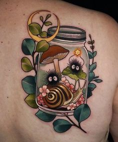 a woman's back with an image of a jar full of mushrooms and leaves