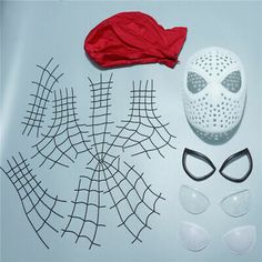 a mask, eyeglasses, and red scarf laid out on a table