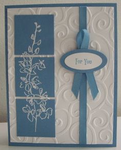 a blue and white card with a ribbon on the front that says, for you