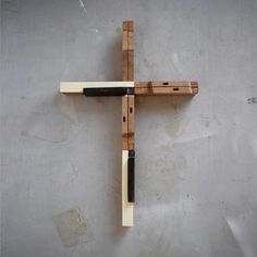 a wooden cross hanging on the wall