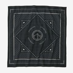 a black and white square scarf with a horse on it