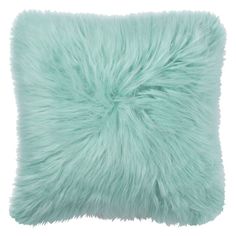 a light green pillow with long fur on it's sides and the back side