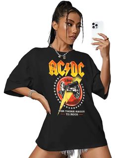 AC/DC Rock Band Women's T-Shirt by American Classics Part Scottish, part Aussie, 100% High Voltage Rock Legends! Formed in Sydney in 1973, AC/DC went from Dirty Deeds Done Dirt Cheap on the Highway to Hell to Back to Black in The Flick of the Switch! They have sold over 200 million albums worldwide and they are still working on new music. Wear some rock history, this cool ACDC Cannon Lightning Bolt Men's T-Shirt is vintage style print with a distressed look as if you bought it at an AC/DC Concer Acdc Oversized Shirt, Acdc Shirt Outfit, Dc Clothing, Acdc Shirt, 90s Bands, Rock History, Oversized Tees, Highway To Hell, Outfit Styling