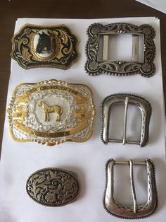 Six Horse/Western/cowboy related belt buckle sold as a lot. And various sizes generally taking a one and a half inch belt. They are in pre-owned (good) condition Please see photographs for condition marks identification and size Rodeo Belt Buckles Wild West Living, Luxury Antique Belt Buckles For Rodeo, Luxury Western Belt Buckles With Belt Included, Luxury Western-style Belts For Western-themed Events, Luxury Vintage Belts For Rodeo, Cowboy Belt Buckle Knife, Western Belt Buckles Party, Luxury Antique Belt Buckles For Western-themed Events, Cheap Vintage Belt Buckles For Gifts