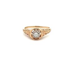 a gold ring with a white diamond in the center