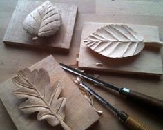 four different types of carving tools on a table