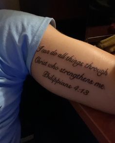 a person with a tattoo on their arm saying, you can do all things through christ who straightens me