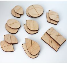 several pieces of wood cut out to look like leaves