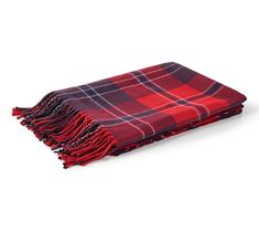 a red and black plaid blanket with fringes on the ends is laying flat against a white background