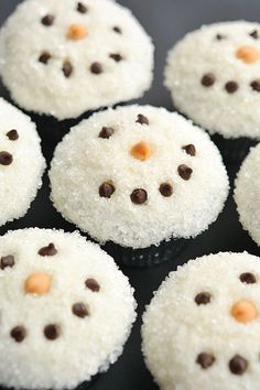 snowman cupcakes are topped with vanilla frosting and chocolate chips