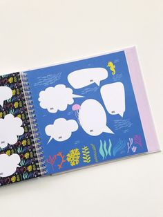 an open notebook with different speech bubbles on it