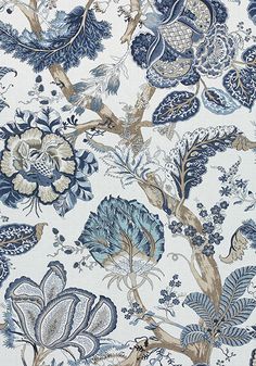 a blue and white floral wallpaper with many different types of flowers, leaves and birds