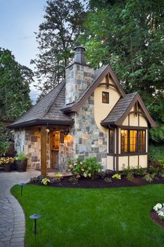 a small house with stone and wood accents