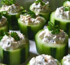 cucumbers with cream cheese and herbs on them