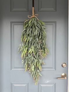 a door with a wreath hanging from it's side