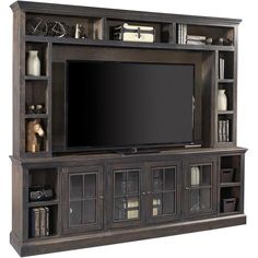 an entertainment center with bookshelves and a flat screen tv