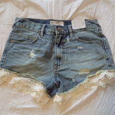 Ne With Tags. Size 25. Lace Or Crochet Hem. Distressed Summer Lace Bottoms With Lace Work, Casual Summer Bottoms With Lace Patchwork, Casual Lace Patchwork Bottoms For Summer, Casual Blue Lace Bottoms, Daisy Duke Shorts, Chambray Shorts, Black Jean Shorts, White Denim Jeans, Ripped Denim Shorts