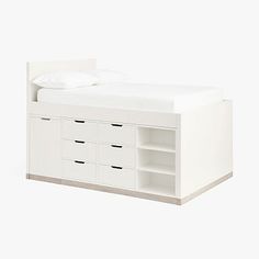 a white bed with drawers underneath it and a pillow on the headboard, in front of a white background