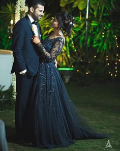 a man and woman dressed in formal wear standing next to each other