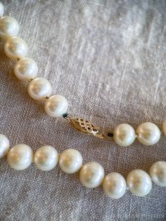 *Classic, Knotted Pearl Necklace *14k Gold clasp *Pearl *Genuine, Freshwater cultured *18 inches, 8mm pearls *Circa 1990s ☞ Some fine jewelry items may show patina or signs of age or wear in photos. Rest assured, your jewelry will be carefully cleaned and polished prior to shipping! If you would like the natural patina left on, send us a note! Quality You Can Trust *Authenticated by a GIA Graduate Gemologist  *Detailed Quality Control and Careful Restoration *5 Star Customer Service. Questions? Send us a message! Timely Processing *Fast & Free Shipping! *Professional Ring Sizing in only 5-10 business days *Personalized Delivery for Gifts or Special Occasions Happiness, Guaranteed * 30 Day Returns and Exchanges More Vintage Jewelry ☞ JewelryOnRepeat.Etsy.com ↓ Additional Item Details ↓ Neck Formal Vintage Akoya Pearl Necklace, Vintage Single Strand Akoya Pearl Jewelry, Classic Pearl Necklace With Jewels For Anniversary, Vintage Pearl Necklace, Vintage Designer Jewelry, Pearl Necklace Vintage, Gold Diamond Band, Detailed Necklace, Vintage Fine Jewelry