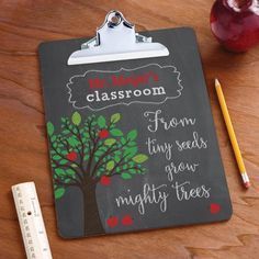 a clipboard with an apple tree drawn on it