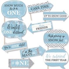 blue winter wedding photo booth props with snowflakes and sayings on them, set of 12