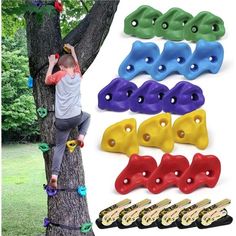 a man climbing up the side of a tree with lots of different colored plastic clips