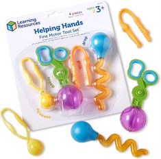 the learning resources helping hands fine motor tool set is packaged in its package and ready to be played with