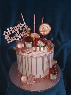 a birthday cake decorated with candies and bottles