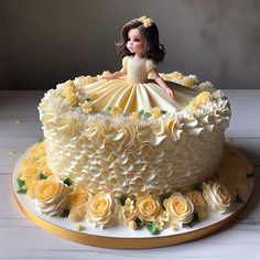 a cake decorated with flowers and a doll on top