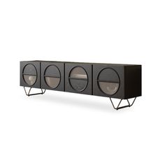 an entertainment center with three speakers on it