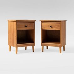 two wooden nightstands side by side with one drawer open and the other closed up