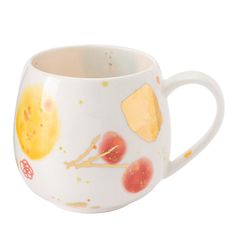 a coffee cup with fruit and cheese painted on the inside, sitting in front of a white background