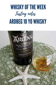 a bottle of ardbeg 10 y o whisk next to a starfish