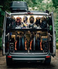 the back end of a van filled with bicycles