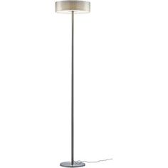 a floor lamp with a white shade on it