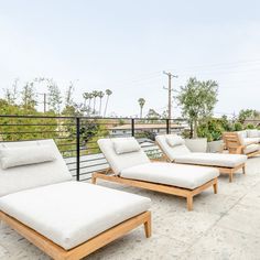 four lounge chairs sitting on top of a roof